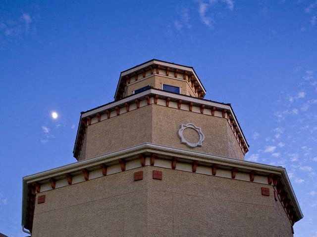 a tall building with a clock on the top of it