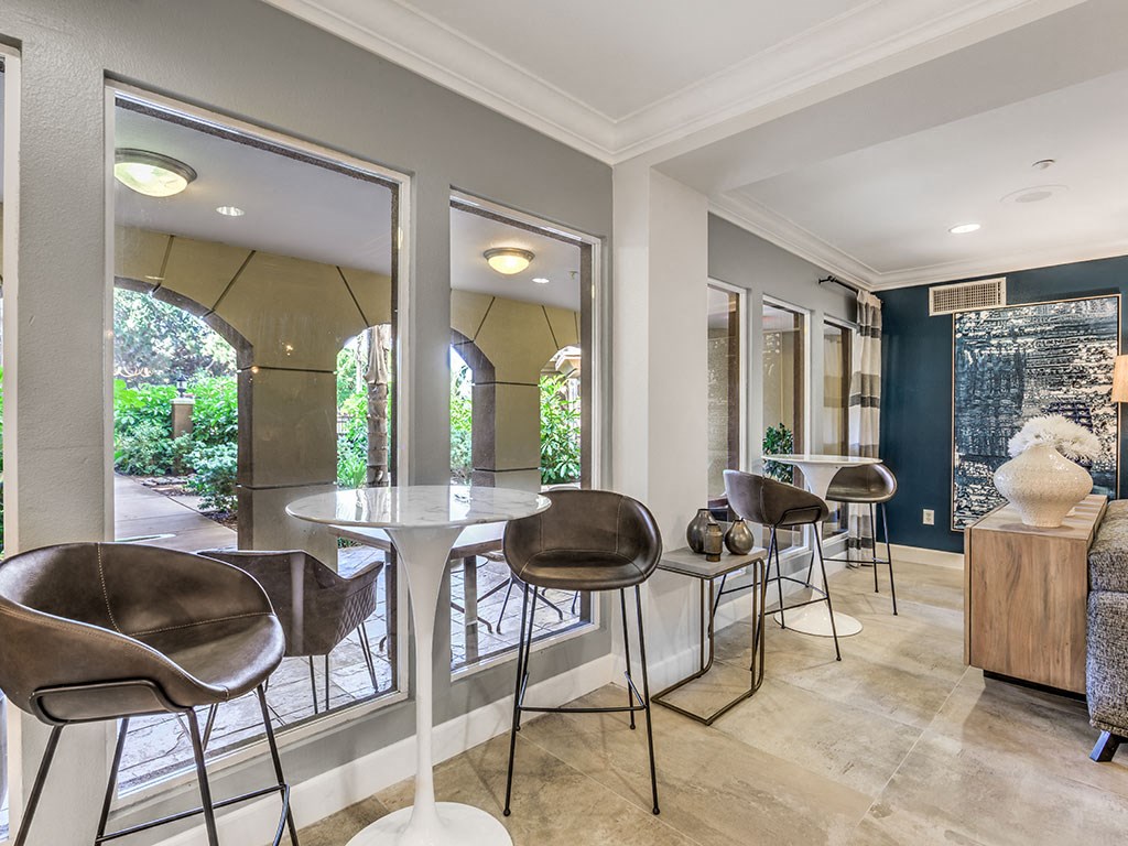 a dining room with chairs and a table