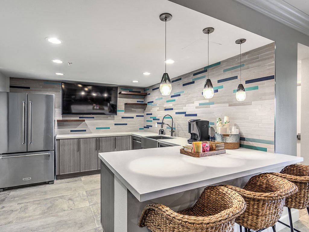 a kitchen with stainless steel appliances and a counter top