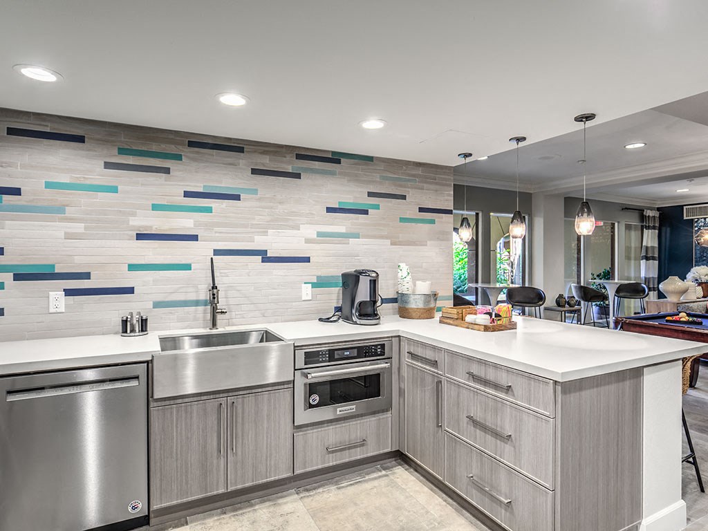 a kitchen with stainless steel appliances and a counter top