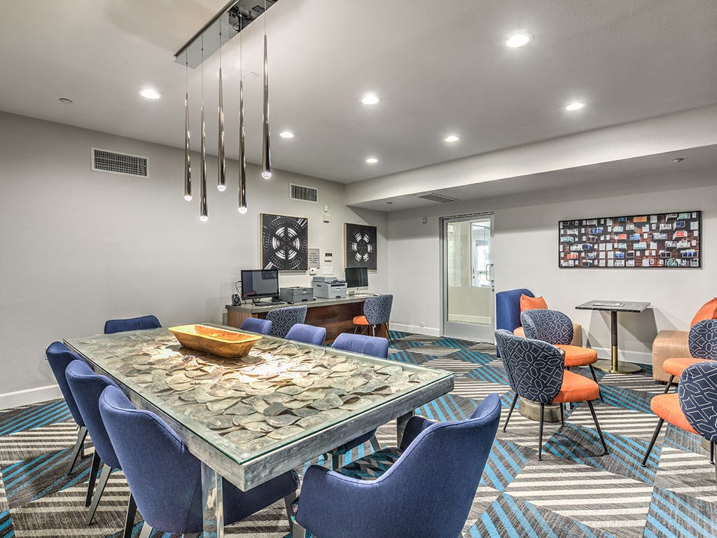 a conference room with a table and chairs