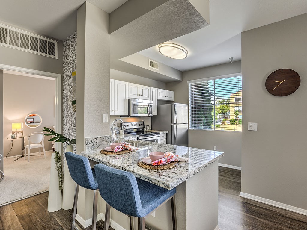a kitchen with a granite counter top