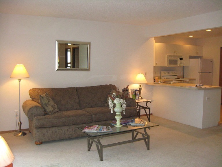 a living room with a couch and a table