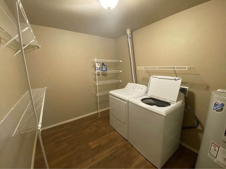 a laundry room with a washer and dryer in it