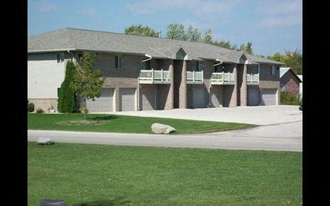 a house with a lawn in front of it