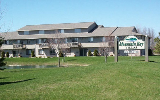a large motel with a sign in front of it