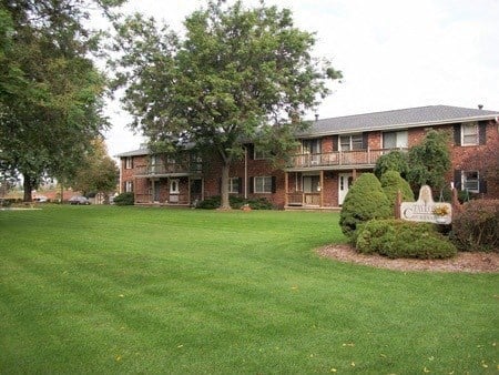 a large yard in front of an apartment building
