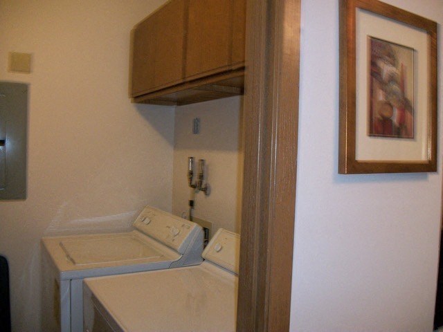 a small bathroom with a toilet and a cabinet