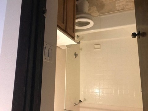 a bathroom with a sink and a toilet in it