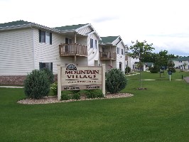 the sign in front of the building of mountain village
