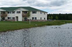 the building where the hotel is located is next to a pond