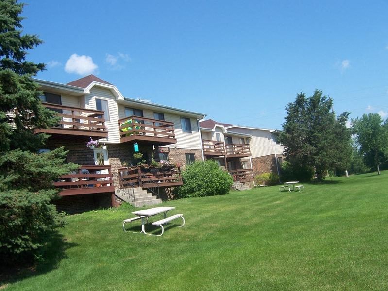 a house with a yard with a picnic table