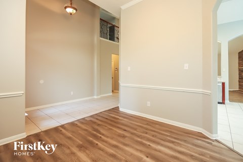the living room and dining room with hardwood flooring