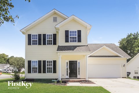 A two-story house with a garage is for sale by FirstKey Homes.