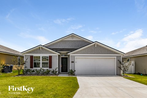 A house with a garage and a driveway is shown with the words "FirstKey Homes" on the bottom left.