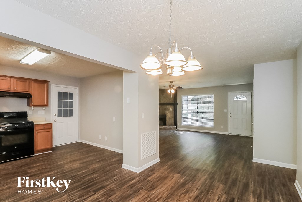 the living room and kitchen of an open floor plan