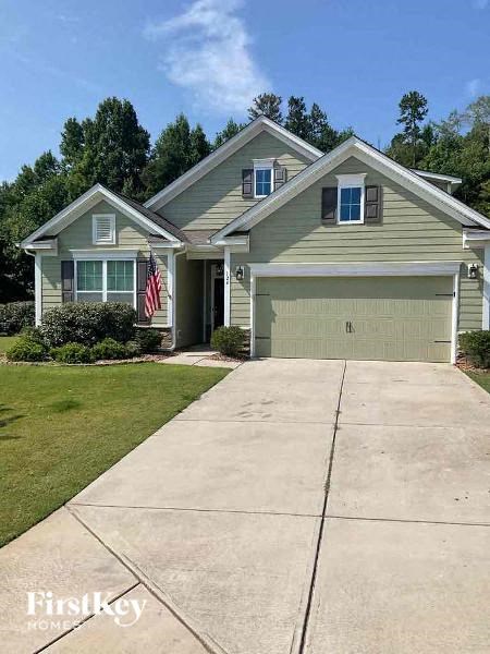a suburban house with a driveway and an flag