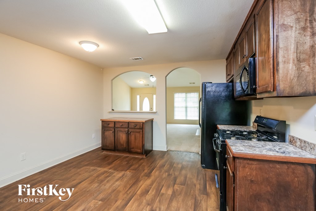 the kitchen is open to the dining room and living room