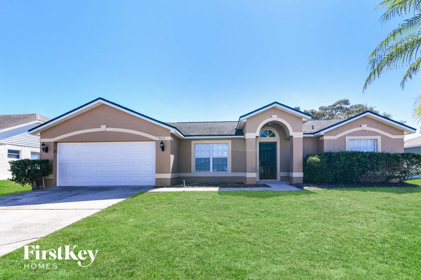 a house with a lawn in front of it