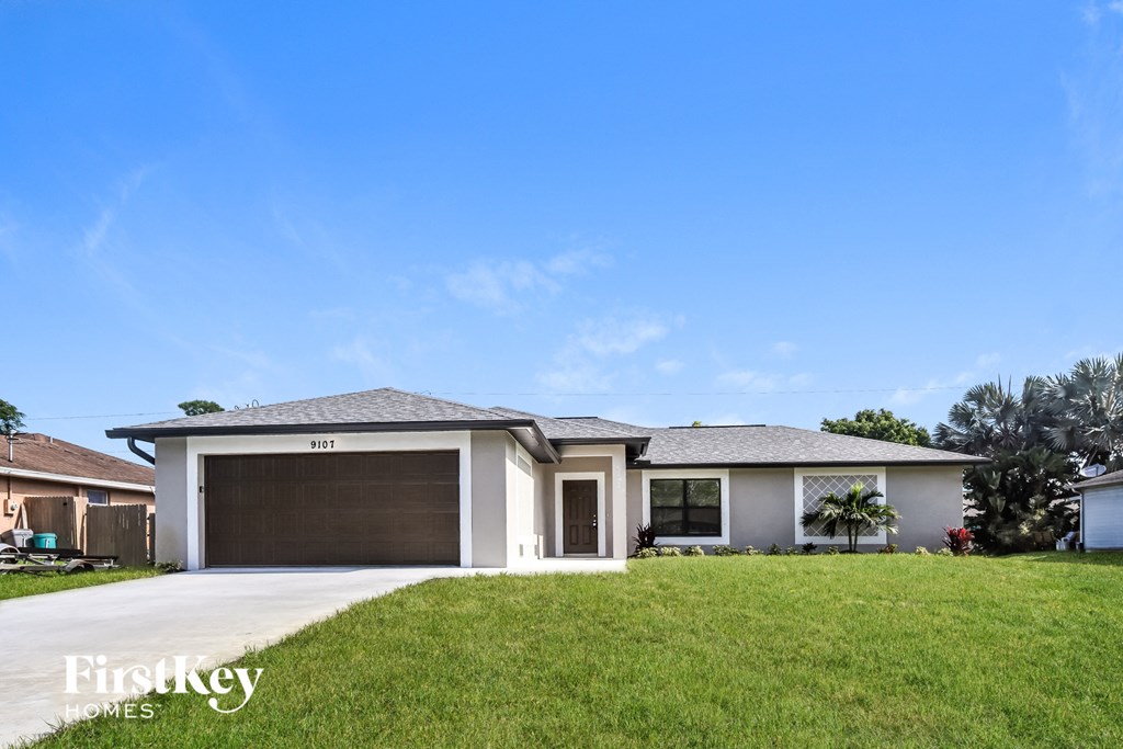 a house with a driveway and a garage door