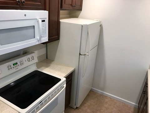 a kitchen with a stove microwave and refrigerator