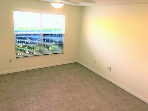 a large empty room with a window