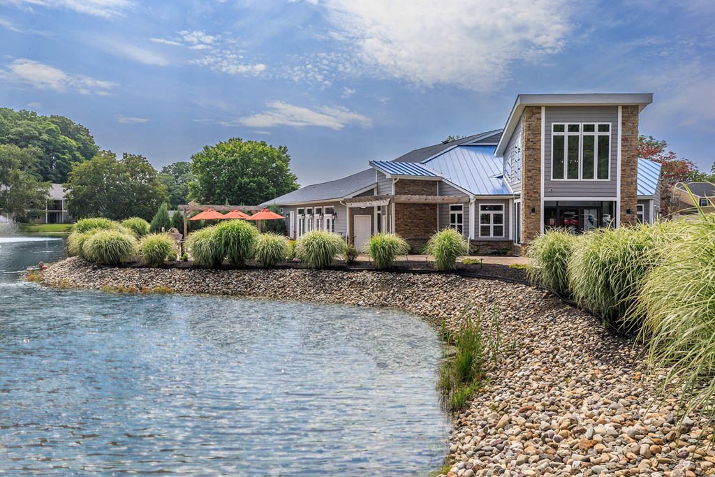 a house next to a body of water