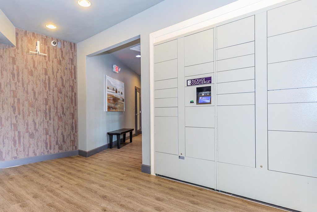 a hallway with white doors and a wood flooring