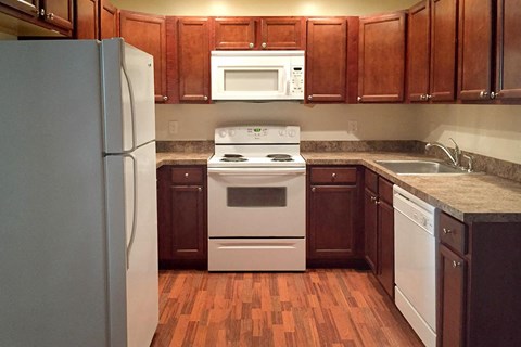 a kitchen with a stove microwave and refrigerator