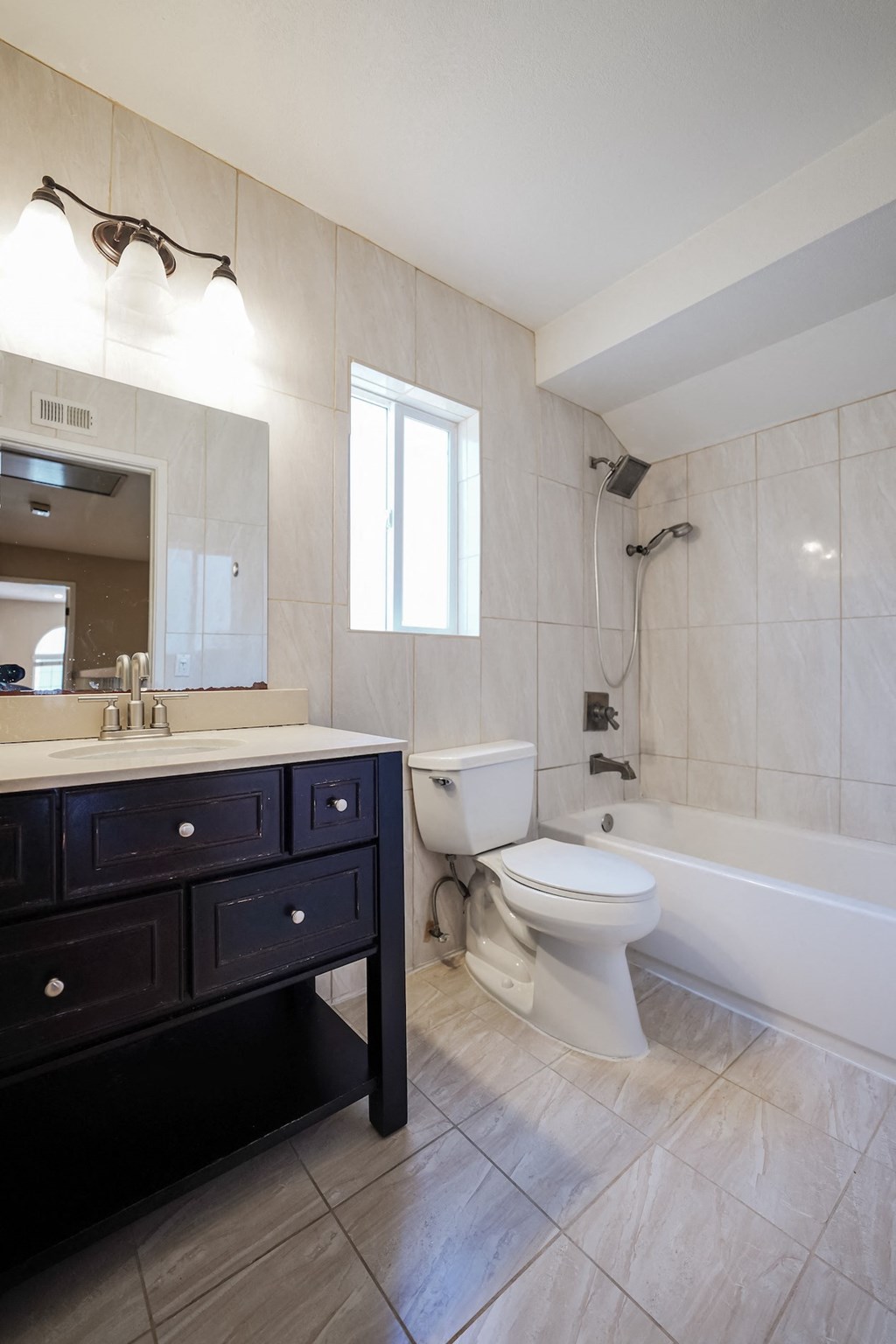 an image of a bathroom with a toilet and a sink