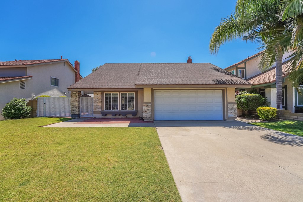a house with a driveway and a garage door