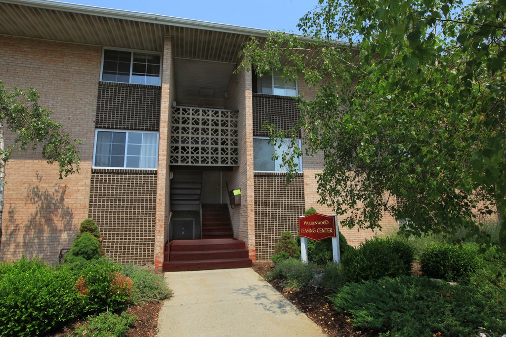 a building with a red sign in front of it