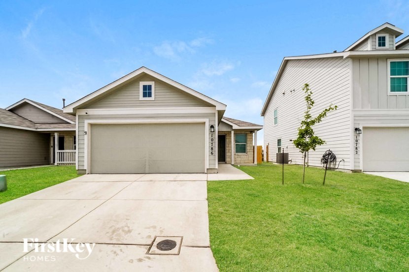 A house with a garage is for sale.