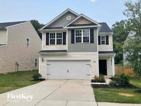 a white house with a white garage door