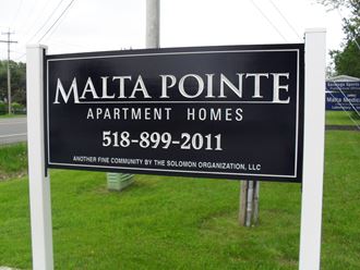 a sign that reads malta pointe apartments homes