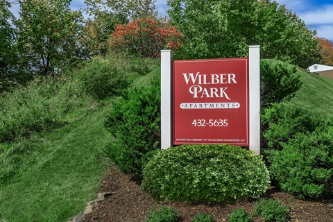 the sign for wilber park at the entrance of the park