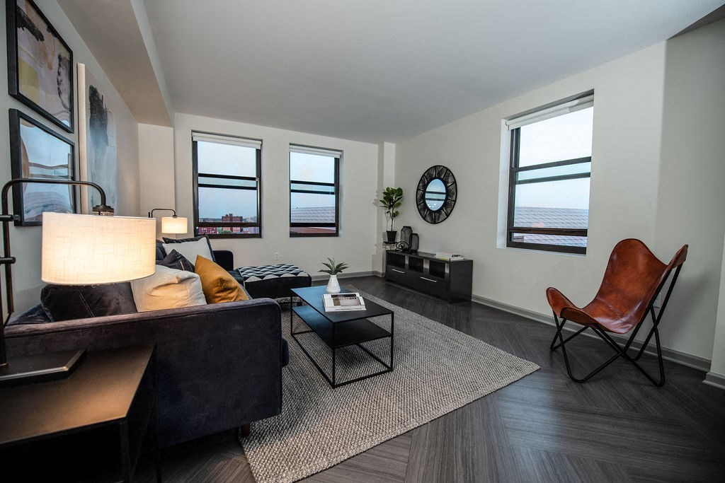 a living room with a couch and a chair