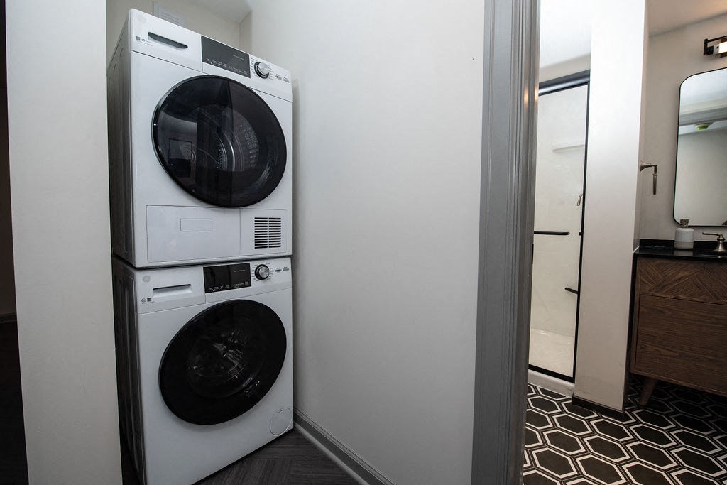 a white washer and dryer in a small room