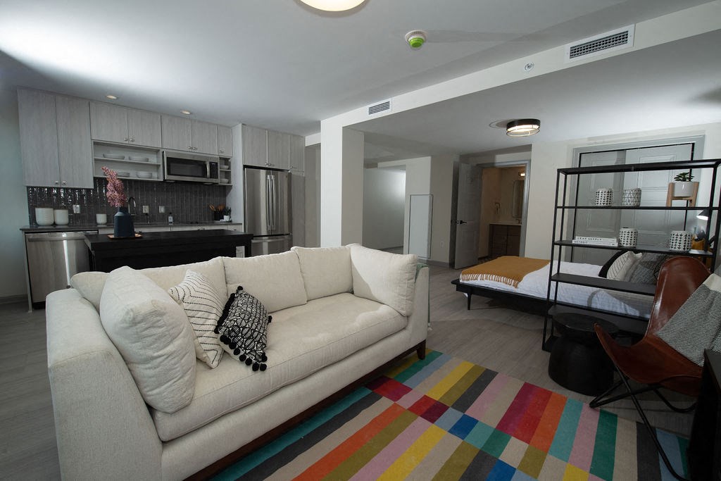 a living room and kitchen with a couch