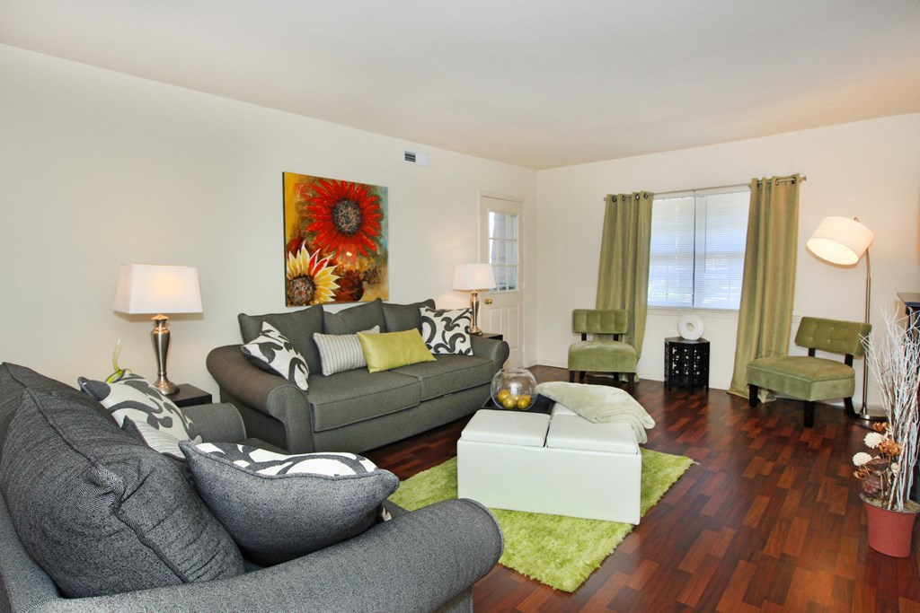 a living room with couches and chairs and a coffee table