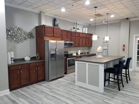 a kitchen with stainless steel appliances and a counter top