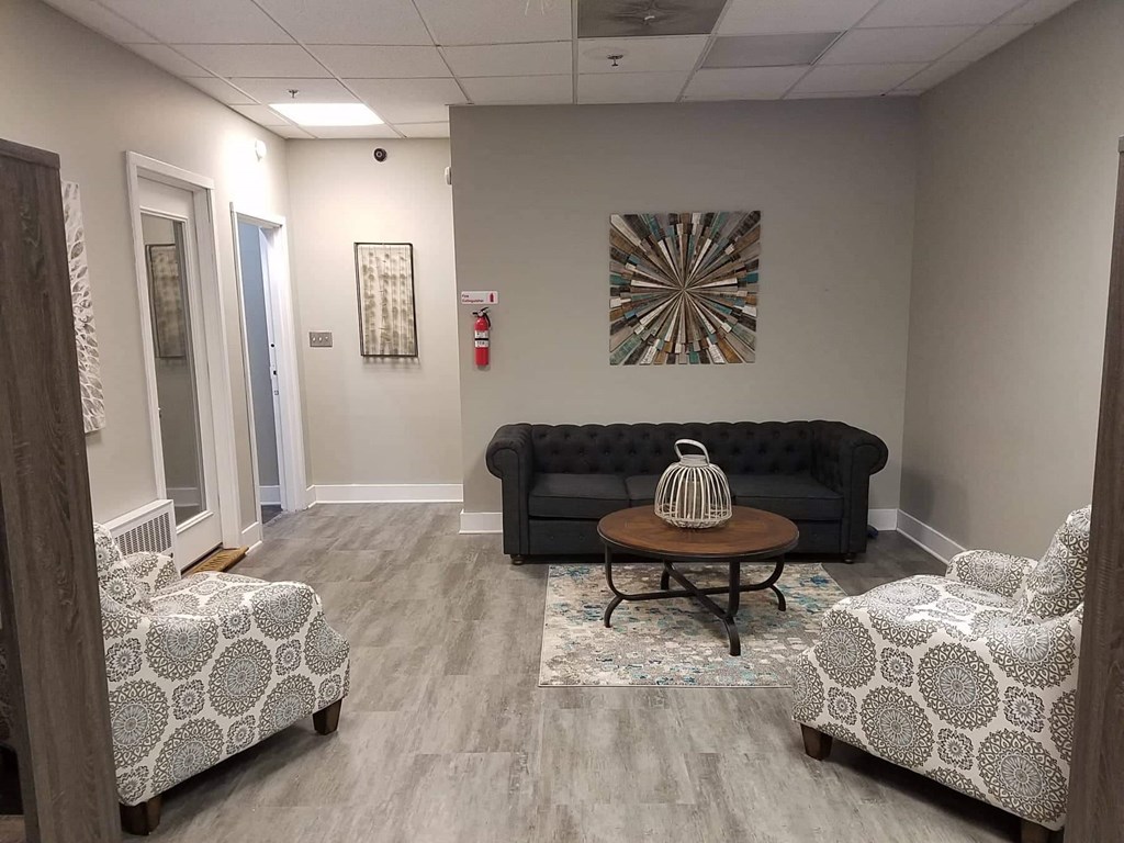 a living room with a couch and a table