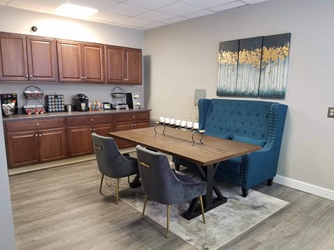 a dining room with a table and chairs