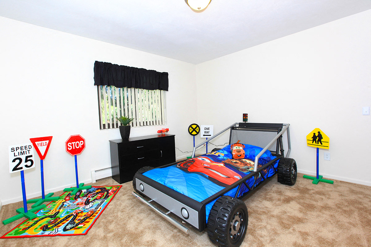 a bedroom with a bed in a room with a truck bed