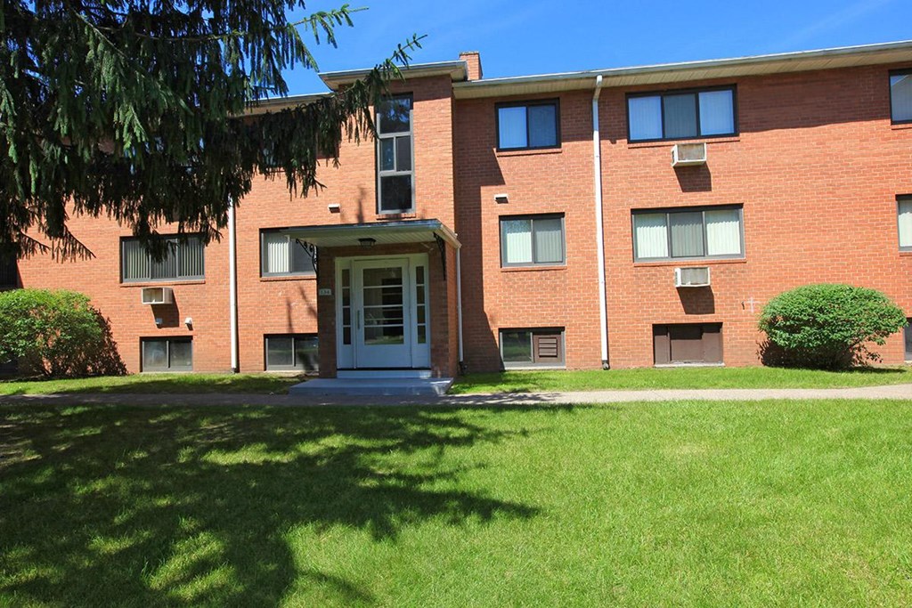 our apartments are located in a quiet neighborhood with green grass