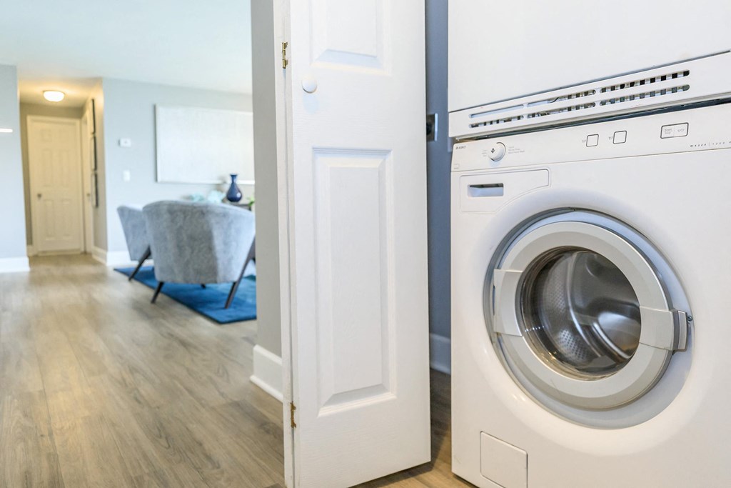 a washer and dryer in a laundry room with a door to the room