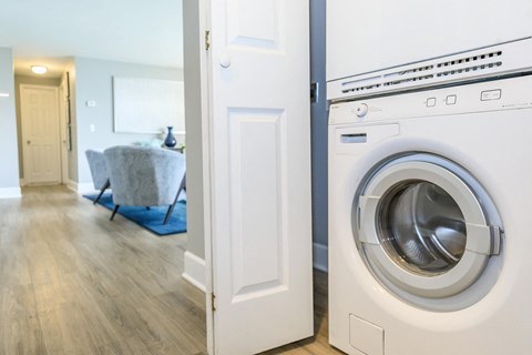 a washer and dryer in a laundry room with a door to the room