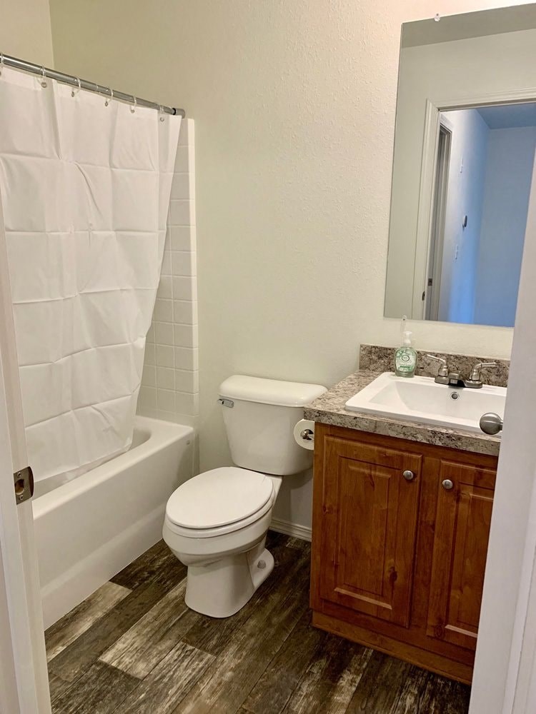 a bathroom with a toilet and a sink