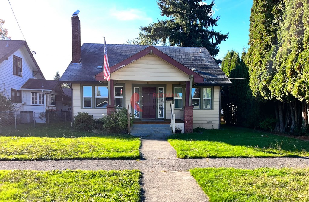 A house with a flag on the front porch.