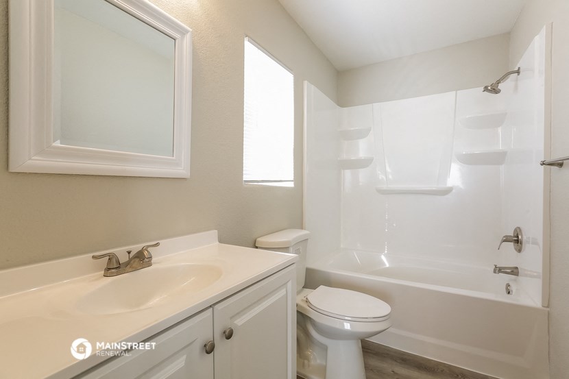 a bathroom with a sink toilet and a shower